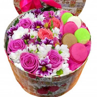 Flowers and macaroons in a box