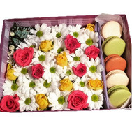 Beautiful box with flowers and macaroons