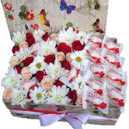 Delicate box of flowers with rafaello