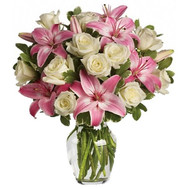 A pretty bouquet of roses and lilies