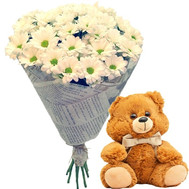 Teddy Bear with a bouquet of chamomiles