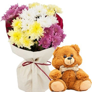 Little bear with a bouquet of chrysanthemums