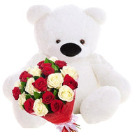 Big teddy bear and a bouquet of roses
