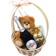 Gift basket with champagne, chocolates and Teddy Bear