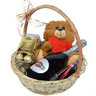 Basket of champagne, toy and sweets