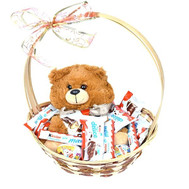 Sweet basket for children with teddy bear