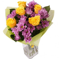 Bouquet of yellow roses and pink chrysanthemums