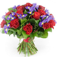Bouquet of red roses and blue irises