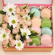 Box of flowers with cakes
