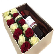 A box of flowers with a gift