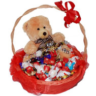 Gift basket of chocolates and teddy bear