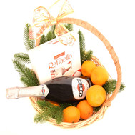 Christmas basket with tangerines, champagne and Raffaello