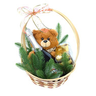 Christmas basket with champagne, chocolates and Teddy Bear