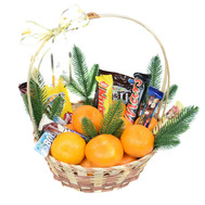 Christmas basket with tangerines and chocolate bars