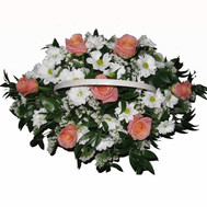 Basket of flowers from roses and chrysanthemums