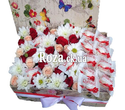 Delicate box of flowers with rafaello