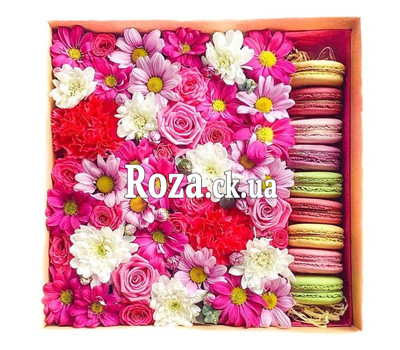 Flowers with pastries in a box