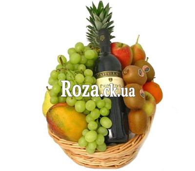 Фрукти і вино в кошику