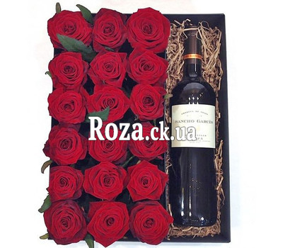 Red roses and wine in a box