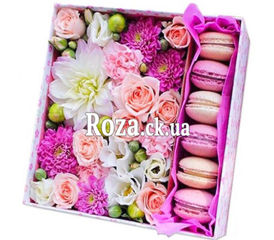 Square box with flowers and pastries