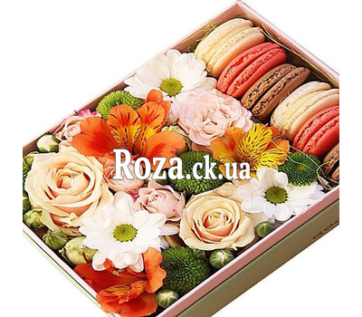 Macarons and flowers in a box