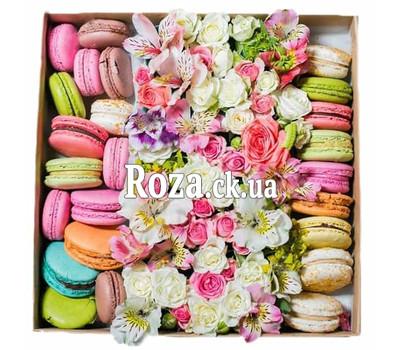 Mix of flowers in a square box with macarons