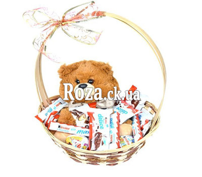 Sweet basket for children with teddy bear
