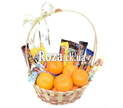 Basket with tangerines and chocolate bars