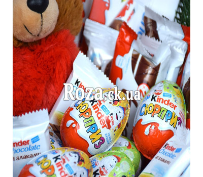 Kinder sweets and Teddy bear in the basket for the New Year 1
