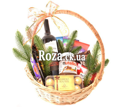 Basket for New Year with wine and chocolate