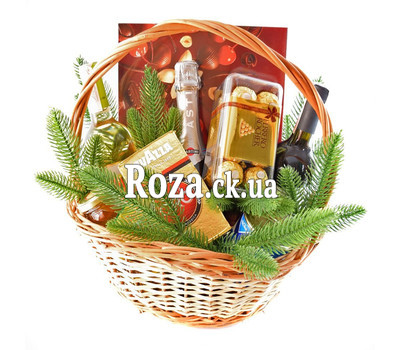 Christmas basket with alcohol and sweets