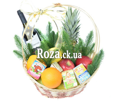 Christmas basket with fruit, wine and cheese