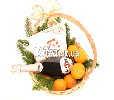 Christmas basket with tangerines, champagne and Raffaello