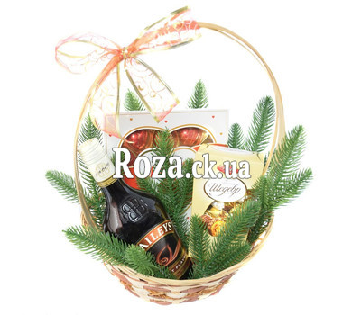 Christmas basket with liqueur and sweets