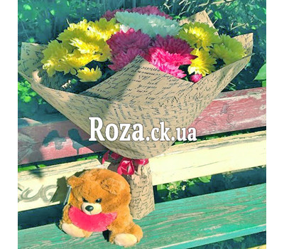 Little bear with a bouquet of chrysanthemums 1