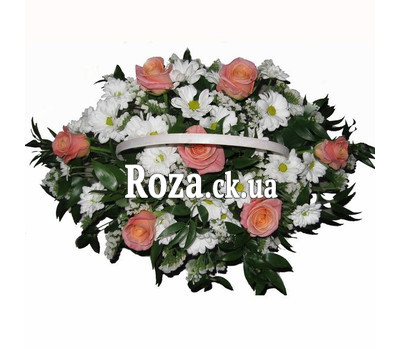 Basket of flowers from roses and chrysanthemums